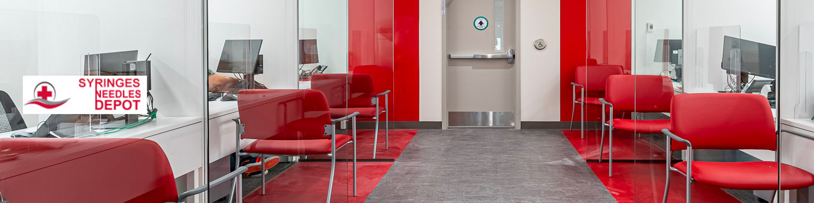 A row of red chairs in an office.